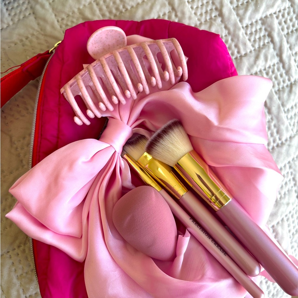 Hot pink Estee Lauder makeup bag set
